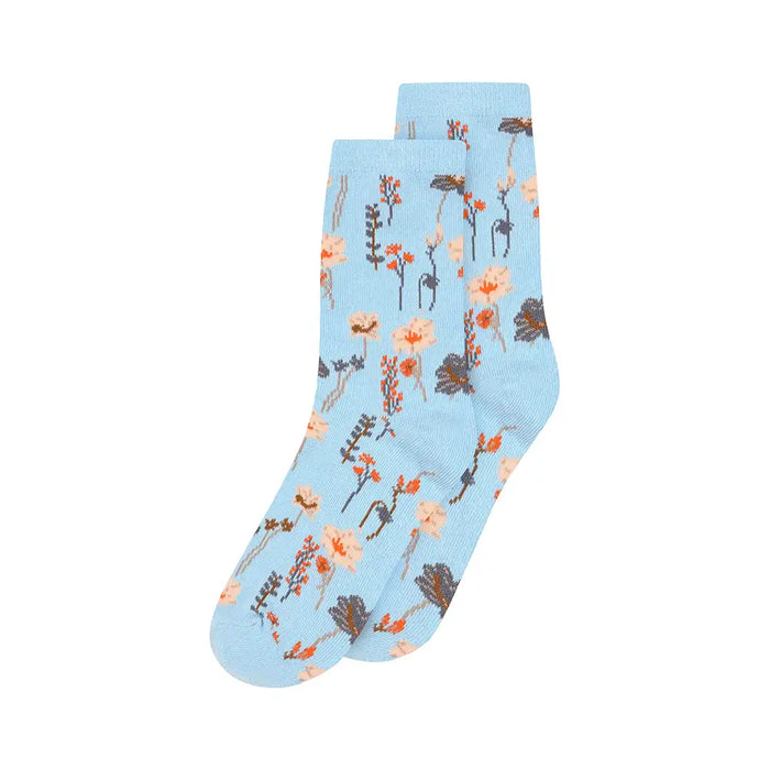 Light blue socks with floral pattern on a white background