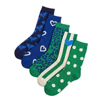 A set of five women's ankle socks in different colors and patterns, arranged diagonally on a light gray background. The socks include navy blue with butterfly prints, royal blue with white heart outlines, green with blue leopard spots and a blue heart accent, and green with white polka dots and white side stripes.