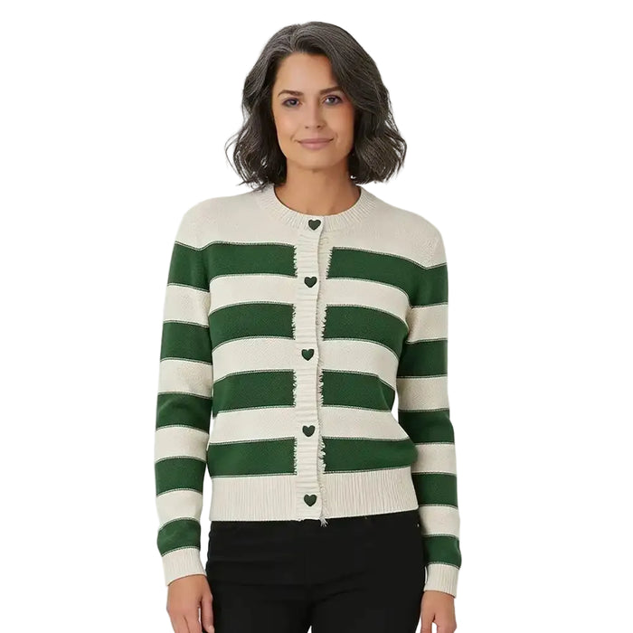 A woman wearing a green and cream striped knit cardigan sweater with heart-shaped buttons, paired with black pants, against a plain white background.