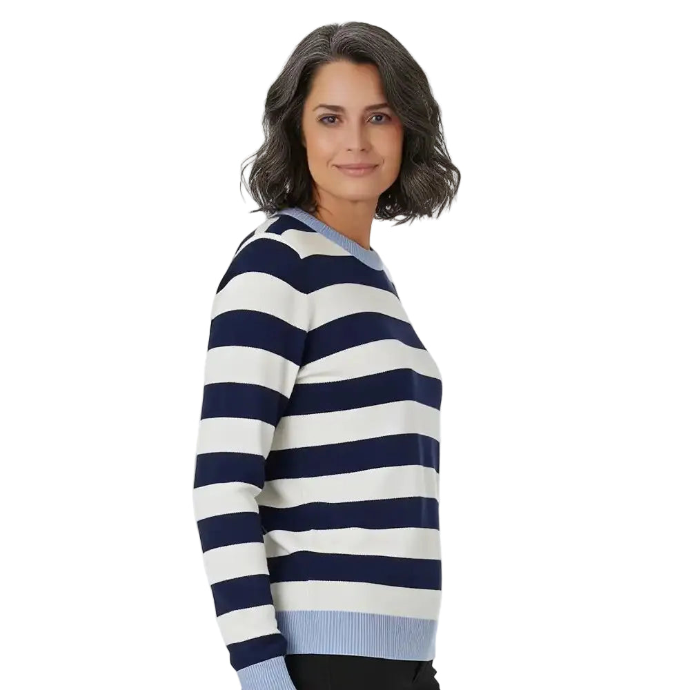 A woman wearing a navy and off-white horizontally striped knit sweater, shown from a side-back angle against a plain white studio background.