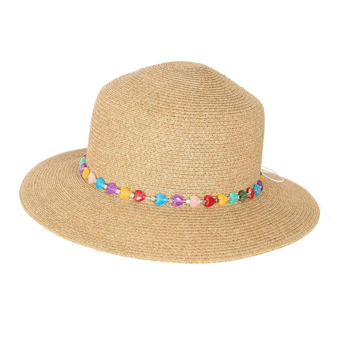 Natural straw coloured hat with heart shaped eads round crown.