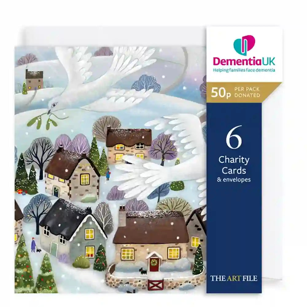 DementiaUK 'The Art File' 50-piece charity card pack featuring a winter village illustration with snow-covered houses, flying white birds, and mistletoe, alongside a navy blue product information panel.