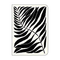 Notebook with black leaf pattern on a white background