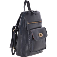 Ashwood Leather backpack in navy blue. Zip access and zip pocket plus fold over flap compartment. Top handle. Angled view.