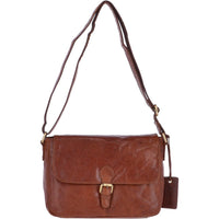 A brown leather messenger bag with a metal popper fastening flap, adjustable shoulder strap, and a rear security pocket.