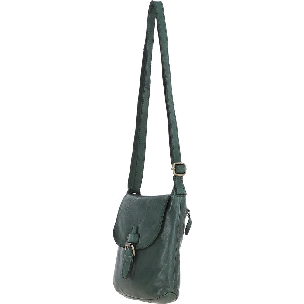 Green leather crossbody bag on a white background