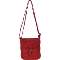 Red leather handbag with a strap on a white background