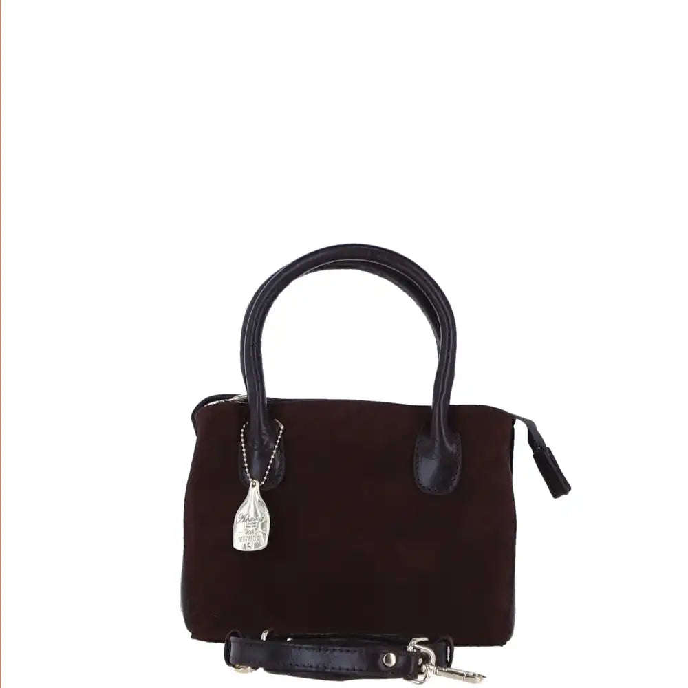 Brown handbag with black handle and strap on a white background
