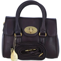 A dark brown pebbled leather handbag with gold-tone hardware, featuring dual top handles, a front flap with a central turn-lock clasp, and a matching detachable shoulder strap coiled in front.