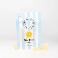 Packaging of Gin Fizz gummies with lemon slices on a light gray background