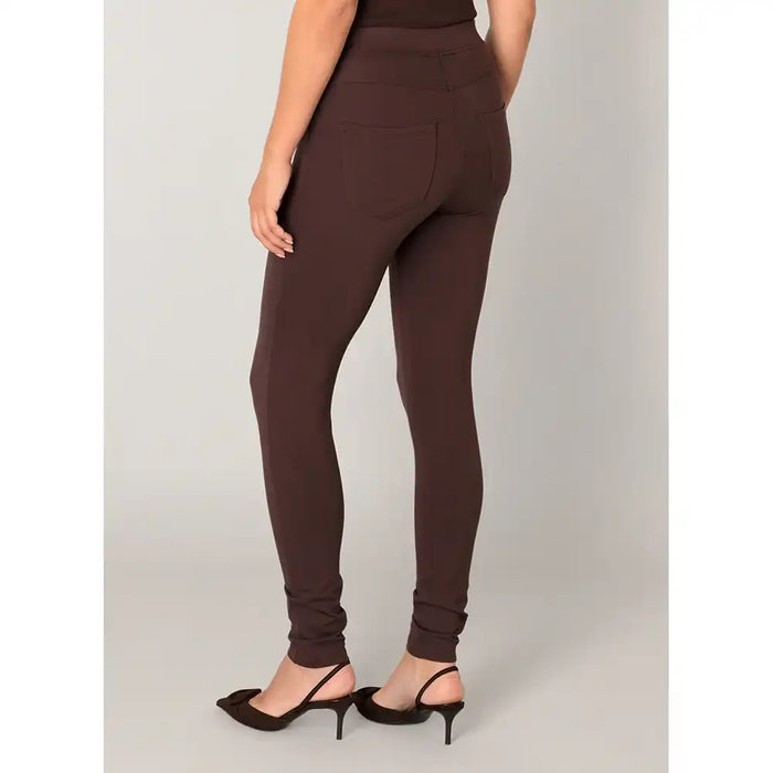 Brown leggings worn by a person on a plain background
