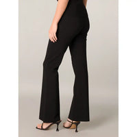 A model shown from the back wearing black high-waisted flared pants and black strappy high-heeled sandals against a light gray studio background.