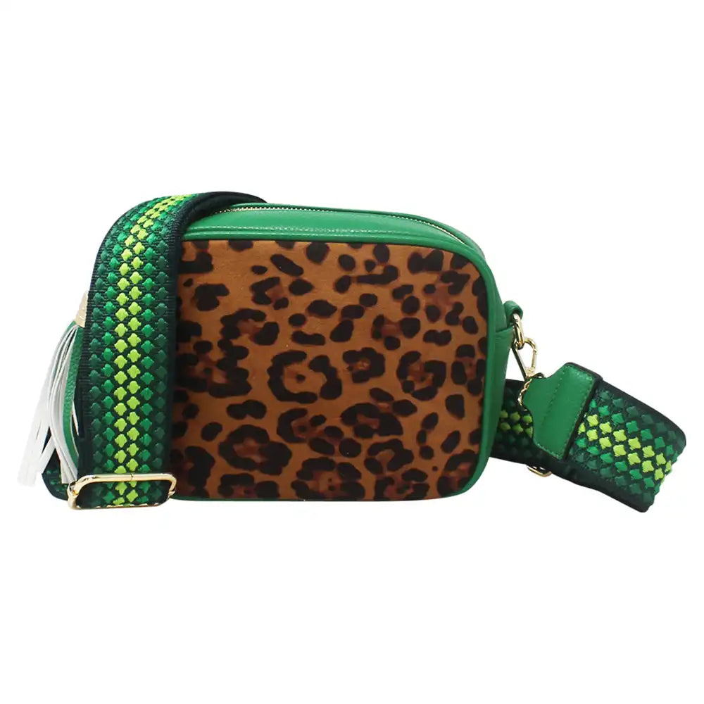 A rectangular crossbody camera bag featuring a brown leopard print pattern on the front, bright green trim, and a green and black woven strap, shown against a plain white background.