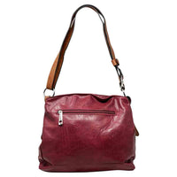 Red bag with a horizontal zip down the front with a tan zip tab. Tan coloured handle. 