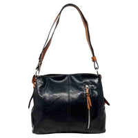 Black bag with a vertical zip down the front with a tan zip tab. Tan coloured handle. 
