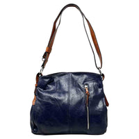 A dark navy blue leather shoulder bag with tan leather trim and a vertical zippered pocket on the front, shown against a plain white background.
