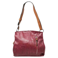 Red bag with a vertical zip down the front with a tan zip tab. Tan coloured handle. 