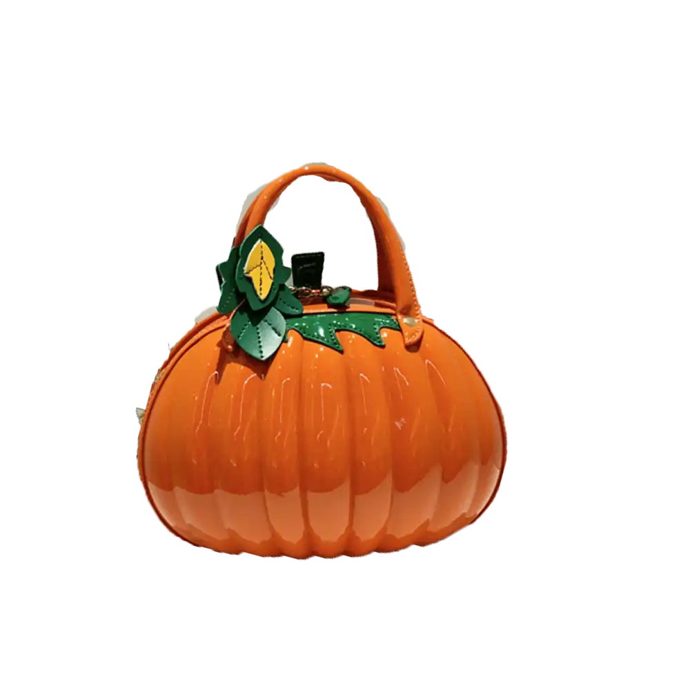 An orange pumpkin-shaped handbag with a glossy finish, featuring a top handle and a green leafy stem detail on the front, set against a plain white background.