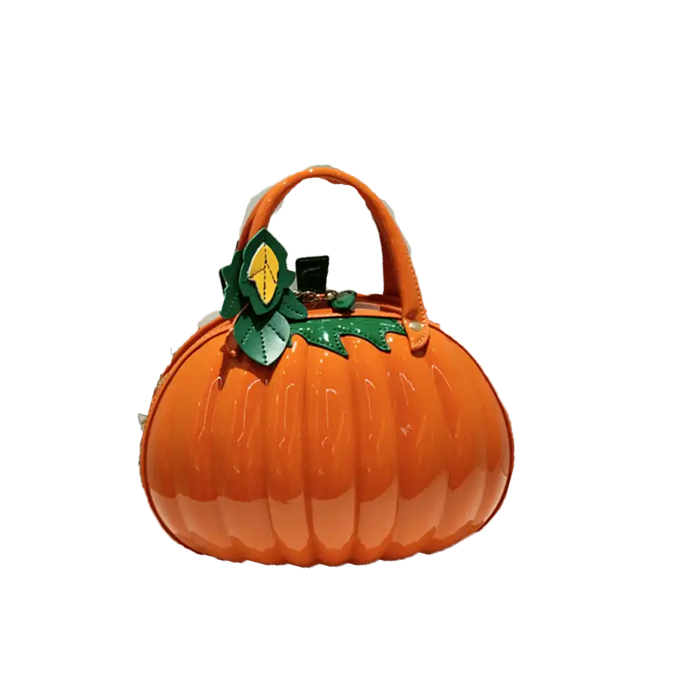 An orange pumpkin-shaped handbag with a glossy finish, featuring a top handle and a green leafy stem detail on the front, set against a plain white background.