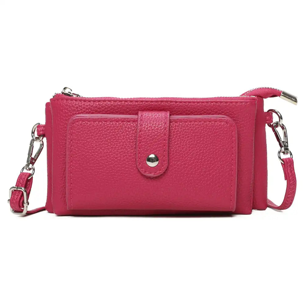 A bright pink pebbled faux-leather crossbody wallet with a front pocket, silver-tone snap button, and matching pink strap with silver hardware, shown on a plain white background.