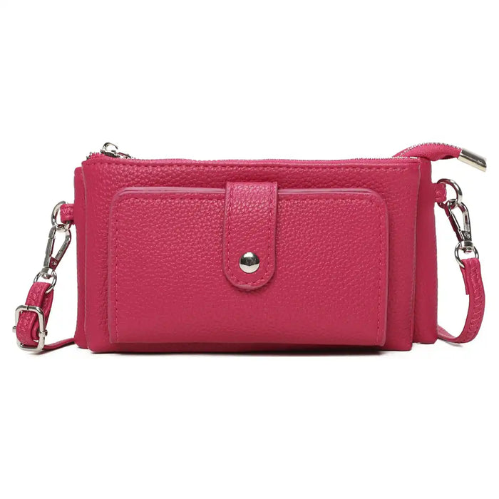 A bright pink pebbled faux-leather crossbody wallet with a front pocket, silver-tone snap button, and matching pink strap with silver hardware, shown on a plain white background.