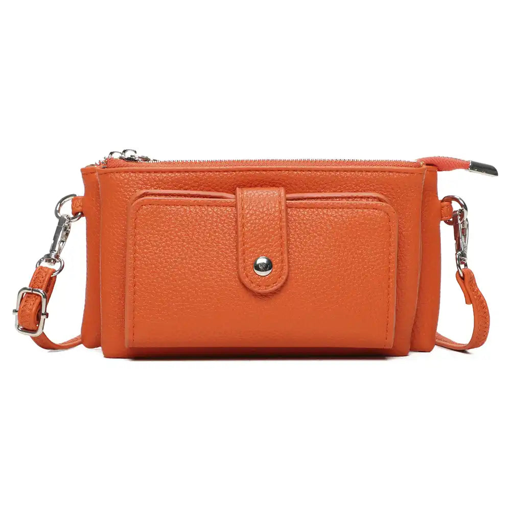 An orange pebbled faux-leather crossbody bag with a front pocket, silver-tone hardware, and a matching orange strap on a white background.