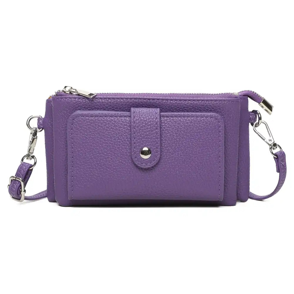 A purple textured faux-leather crossbody wallet with a front pocket, silver-tone snap button, and matching purple strap with silver hardware, shown on a plain white background.