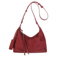 A red suede hobo shoulder bag with a matching leather strap and a small side pouch, shown against a plain white background.