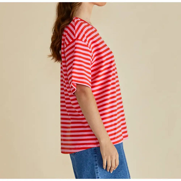 Side of red and pink stripe top with elbow length sleeves. 