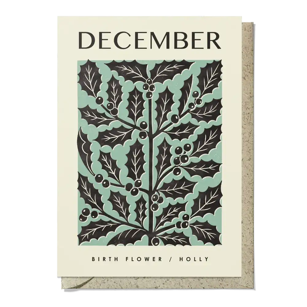 Card with holly leaf design and 'December' text on a beige background