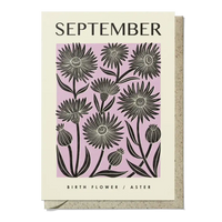 Card with black floral design on a pink background, featuring the word 'September' and 'Aster' text.