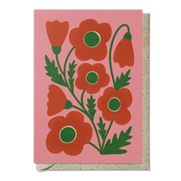 Card with red floral design on a pink background