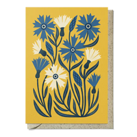 Greeting card with blue and white floral design on a yellow background
