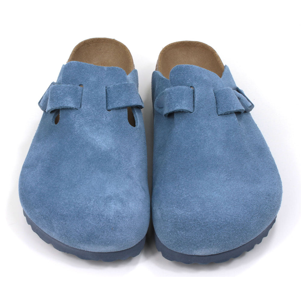 Birkenstock sky blue suede clogs with buckled strap. Open backs and sculpted inner soles. Cork and rubber soles. Front view.