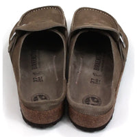 Birkenstock Buckley mid taupe mule shoes with over the foot strap with silver buckle. Moccasin styling. Cork and black rubber soles. Back view.