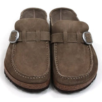 Birkenstock Buckley mid taupe mule shoes with over the foot strap with silver buckle. Moccasin styling. Cork and black rubber soles. Front view.