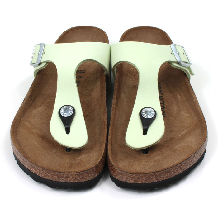 Birkenstock Gizeh toe post sandals in faded lime colour. Cork sculpted insoles and black rubber soles. Silver side buckle. Front view.