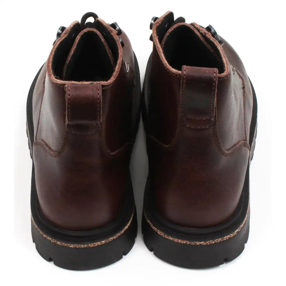 Birkenstock Highwood sturdy 7 eye lace up walking boots in rich brown leather. Cork and rubber soles. Back view.