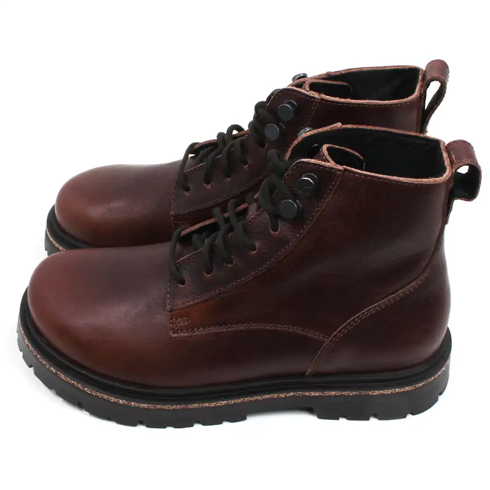 Birkenstock Highwood sturdy 7 eye lace up walking boots in rich brown leather. Cork and rubber soles. Side view.