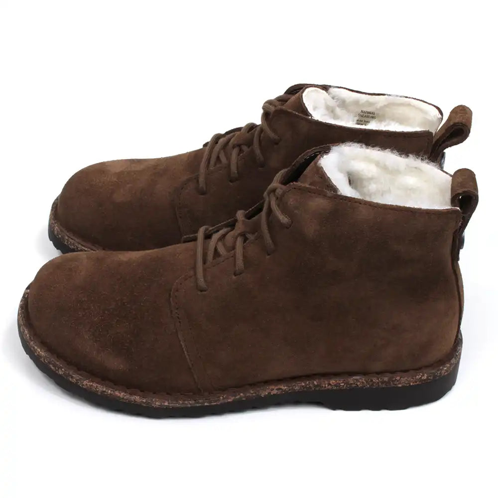 Birkenstock Uppsala Shearling lace up ankle boots in Dark Tea colour. Suede uppers. Flat cork and rubber soles. Fur lined. Side view.