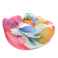 Colorful tie-dye scarf on a white background
