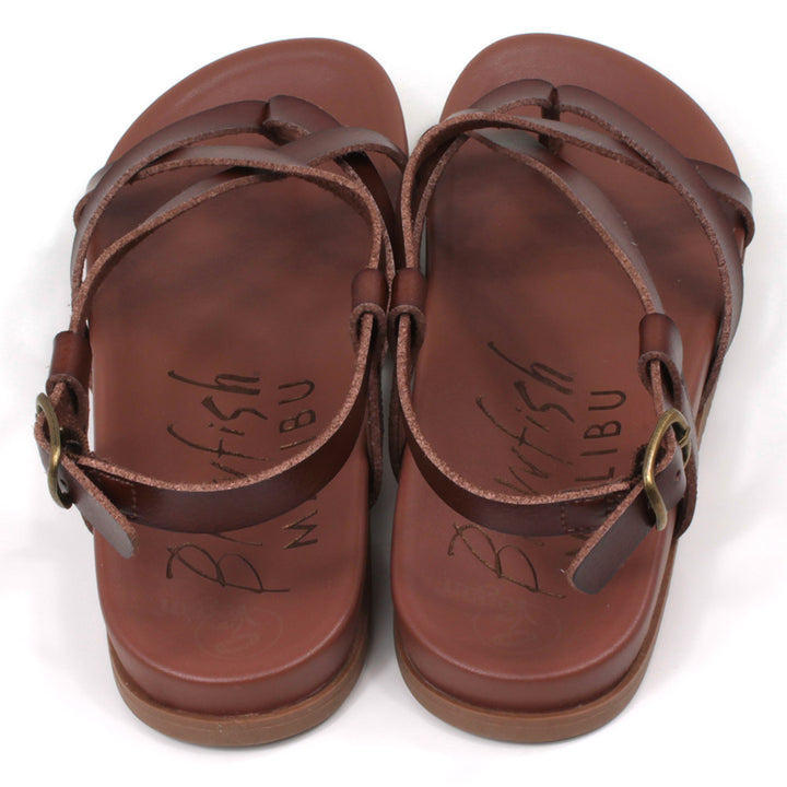 Blowfish Malibu strappy sandals in brown. Toe post style. Metal buckles for adjusting ankle straps. Back view.