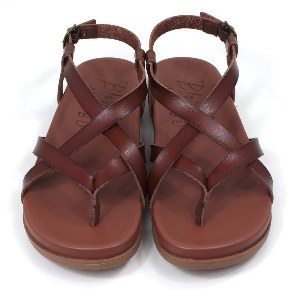 Blowfish Malibu strappy sandals in brown. Toe post style. Metal buckles for adjusting ankle straps. Front view.