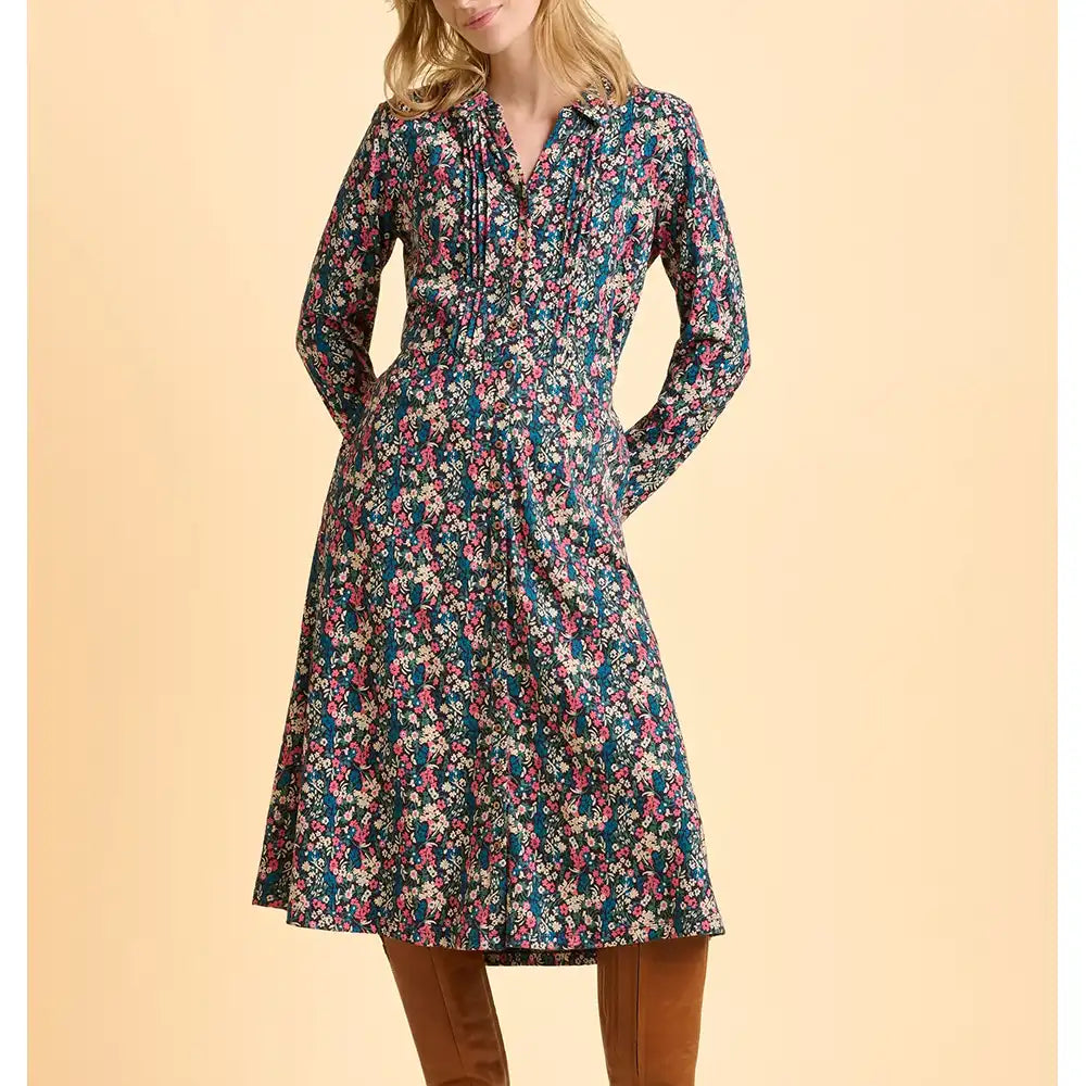 Woman wearing a floral dress on a beige background