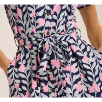 Navy blue dress with pink floral pattern on a plain background