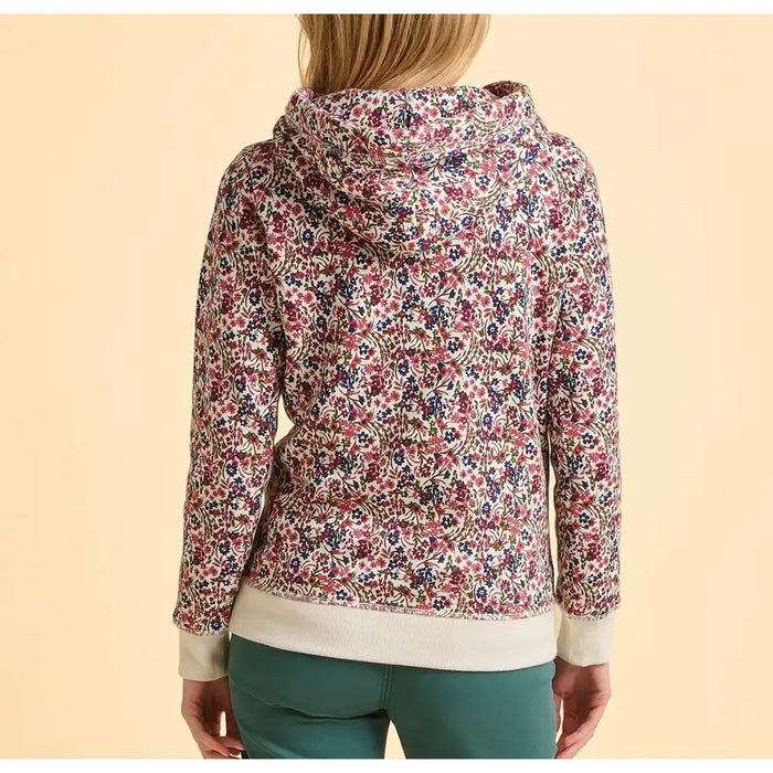 Floral patterned hoodie worn by a person on a beige background
