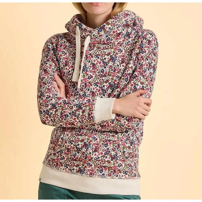 Floral patterned hoodie worn by a person on a beige background