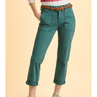 Teal pants with a brown belt on a beige background