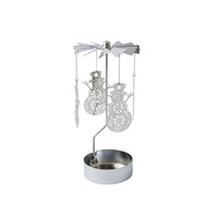 A silver metal snowman-themed candle holder with a wind spinner top, hanging snowman and snowflake cutouts, and a round candle holder base on a white background.