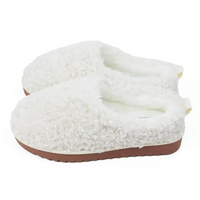 White fuzzy slippers with brown soles on a white background